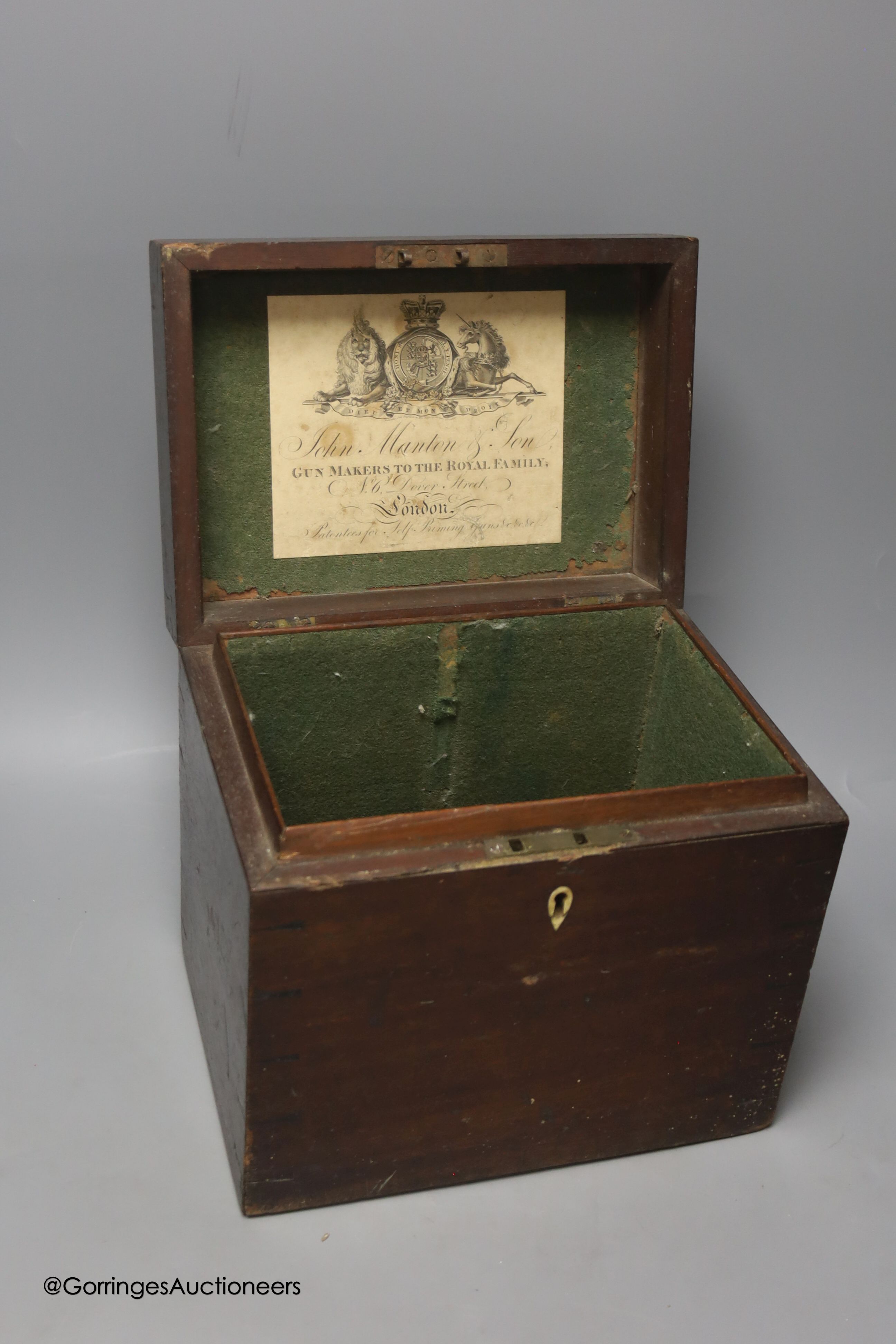 A 19th century mahogany box, labelled for John Manton & Son, Gun Makers to the Royal Family, height 24cm width 27cm